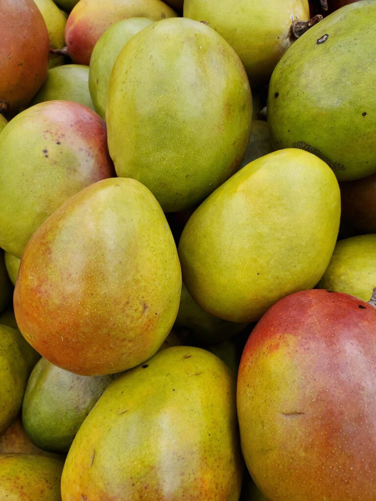 Vibrant close-up of ripe mangoes, highlighting their tropical freshness and appeal.